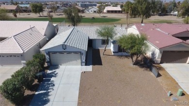 Discover this stunning 3-bedroom, 2-bath home located on a on Desert Lakes Golf Course in Arizona - for sale on GolfHomes.com, golf home, golf lot