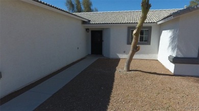 Discover this stunning 3-bedroom, 2-bath home located on a on Desert Lakes Golf Course in Arizona - for sale on GolfHomes.com, golf home, golf lot