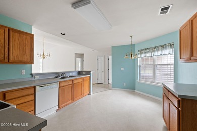 Now available is this wonderful one level ranch style home in on Sandpiper Bay Golf and Country Club in North Carolina - for sale on GolfHomes.com, golf home, golf lot