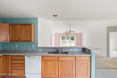 Now available is this wonderful one level ranch style home in on Sandpiper Bay Golf and Country Club in North Carolina - for sale on GolfHomes.com, golf home, golf lot