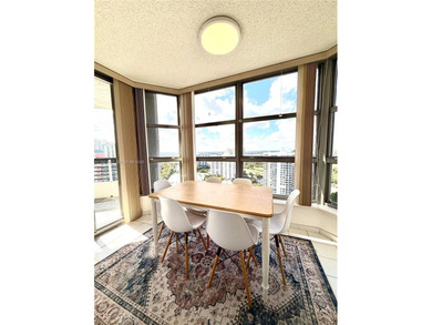 Experience refined luxury and stunning panoramic views in this on Turnberry Isle Resort and Club in Florida - for sale on GolfHomes.com, golf home, golf lot