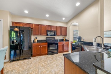 Under contract-accepting backup offers. WELL-MAINTAINED on Tampa Bay Golf and Country Club in Florida - for sale on GolfHomes.com, golf home, golf lot
