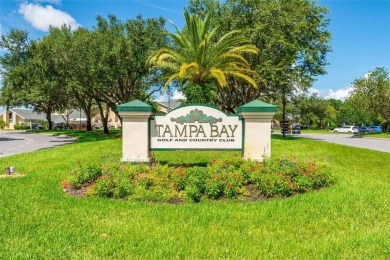 Under contract-accepting backup offers. WELL-MAINTAINED on Tampa Bay Golf and Country Club in Florida - for sale on GolfHomes.com, golf home, golf lot