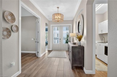 This nearly new luxury residence in the prestigious Marsh Cove on The Golf Club At Fiddlers Creek in Florida - for sale on GolfHomes.com, golf home, golf lot