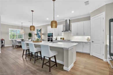 This nearly new luxury residence in the prestigious Marsh Cove on The Golf Club At Fiddlers Creek in Florida - for sale on GolfHomes.com, golf home, golf lot