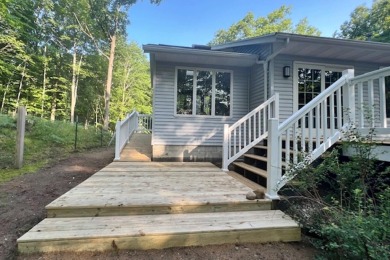 Move-in ready 3-bedroom, 2-bath ranch in the peaceful hills of on Canadian Lakes Country Club-The Highlands Course in Michigan - for sale on GolfHomes.com, golf home, golf lot