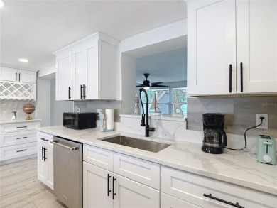 Live the Florida lifestyle in the highly sought-after waterfront on Gulf Harbors Golf Course in Florida - for sale on GolfHomes.com, golf home, golf lot
