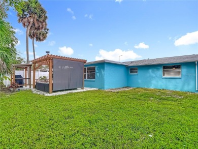 Live the Florida lifestyle in the highly sought-after waterfront on Gulf Harbors Golf Course in Florida - for sale on GolfHomes.com, golf home, golf lot