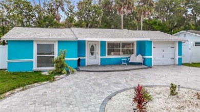 Live the Florida lifestyle in the highly sought-after waterfront on Gulf Harbors Golf Course in Florida - for sale on GolfHomes.com, golf home, golf lot