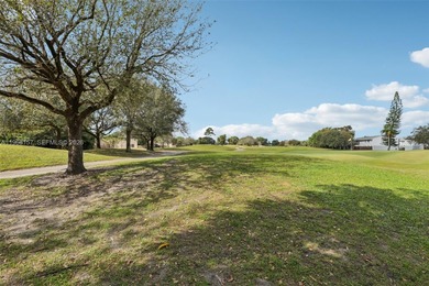 Step outside to your private backyard oasis with direct, serene on Davie Golf Club in Florida - for sale on GolfHomes.com, golf home, golf lot