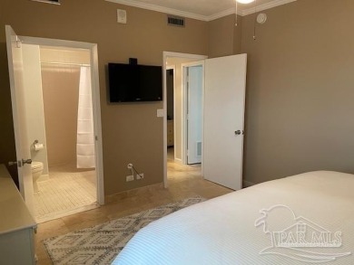 This beautifully furnished, wheelchair-accessible corner unit on on Pensacola Country Club in Florida - for sale on GolfHomes.com, golf home, golf lot