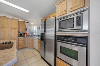 This 2005 home with 1,706sq ft of living space features the on Maple Leaf Golf and Country Club in Florida - for sale on GolfHomes.com, golf home, golf lot