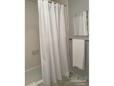 This beautifully furnished, wheelchair-accessible corner unit on on Pensacola Country Club in Florida - for sale on GolfHomes.com, golf home, golf lot