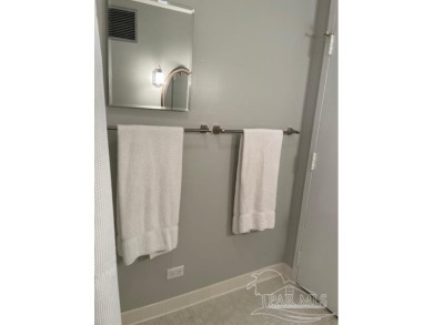 This beautifully furnished, wheelchair-accessible corner unit on on Pensacola Country Club in Florida - for sale on GolfHomes.com, golf home, golf lot