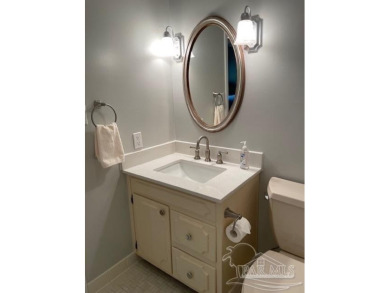 This beautifully furnished, wheelchair-accessible corner unit on on Pensacola Country Club in Florida - for sale on GolfHomes.com, golf home, golf lot