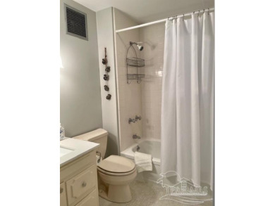 This beautifully furnished, wheelchair-accessible corner unit on on Pensacola Country Club in Florida - for sale on GolfHomes.com, golf home, golf lot