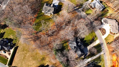 This fantastic half-acre lot offers an exceptional opportunity on Rock Barn Golf and Spa in North Carolina - for sale on GolfHomes.com, golf home, golf lot