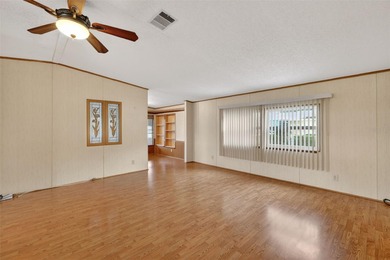 Welcome home to this charming 2 Bedroom, 2 Bathroom residence on Zellwood Station Country Club in Florida - for sale on GolfHomes.com, golf home, golf lot