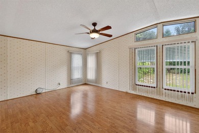 Welcome home to this charming 2 Bedroom, 2 Bathroom residence on Zellwood Station Country Club in Florida - for sale on GolfHomes.com, golf home, golf lot