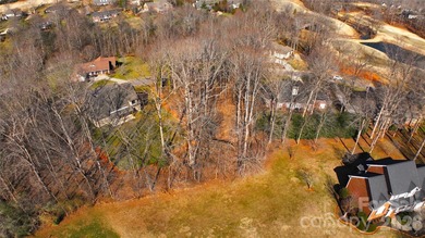 This fantastic half-acre lot offers an exceptional opportunity on Rock Barn Golf and Spa in North Carolina - for sale on GolfHomes.com, golf home, golf lot