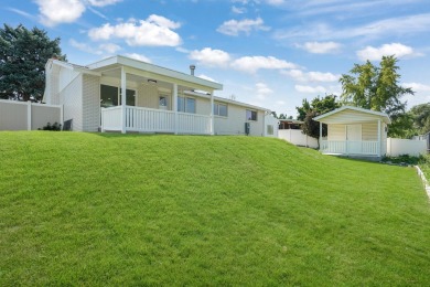 Nestled in the heart of Murray, this beautifully renovated home on Mick Riley Golf Course in Utah - for sale on GolfHomes.com, golf home, golf lot