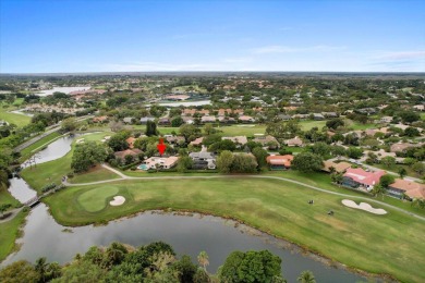 Stunning 4-bedroom, 3.5-bathroom pool home with a 2-car garage on PGA National Golf Club in Florida - for sale on GolfHomes.com, golf home, golf lot