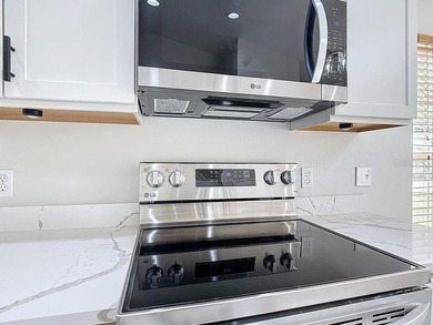 Some photos are virtually  staged. ***See the FULL LENGTH VIDEO on Stonegate Golf Club in Florida - for sale on GolfHomes.com, golf home, golf lot