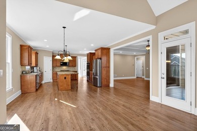 Located in BridgeMill, this well-maintained home offers the on Bridgemill Golf Club in Georgia - for sale on GolfHomes.com, golf home, golf lot