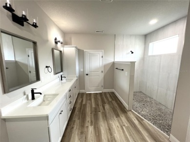 Built in 2023! This 4 bedroom, 3 bathroom, 3 car garage home has on The Grand Club - Pine Lakes Course in Florida - for sale on GolfHomes.com, golf home, golf lot