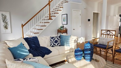 From the moment you step inside this sun-filled end-unit on Belvedere Country Club in North Carolina - for sale on GolfHomes.com, golf home, golf lot