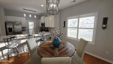 From the moment you step inside this sun-filled end-unit on Belvedere Country Club in North Carolina - for sale on GolfHomes.com, golf home, golf lot