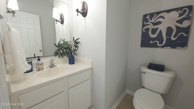 From the moment you step inside this sun-filled end-unit on Belvedere Country Club in North Carolina - for sale on GolfHomes.com, golf home, golf lot