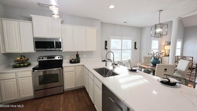 From the moment you step inside this sun-filled end-unit on Belvedere Country Club in North Carolina - for sale on GolfHomes.com, golf home, golf lot