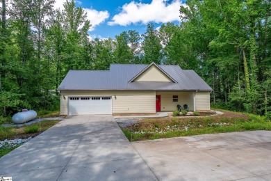 Tucked beside a quiet creek and backing up to The Rock Golf Club on The Rock At Jocassee in South Carolina - for sale on GolfHomes.com, golf home, golf lot