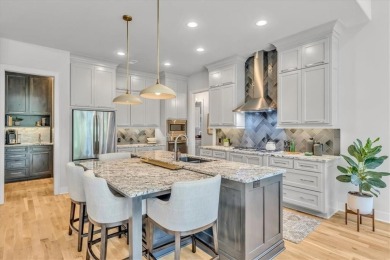 Exquisite Don Julian Reverse 1.5-Story with Golf Course Views in on Staley Farms Golf Club in Missouri - for sale on GolfHomes.com, golf home, golf lot