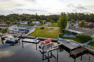 This is the one you've been waiting for -- 66 feet of waterfront on Gulf Harbors Golf Course in Florida - for sale on GolfHomes.com, golf home, golf lot