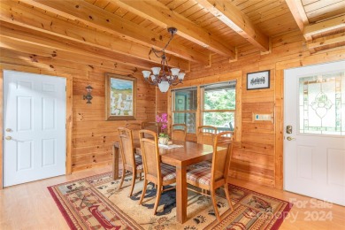 NO DAMAGE FROM HELENE-HIGH  DRY. This warm and inviting log home on Waynesville Country Club Inn in North Carolina - for sale on GolfHomes.com, golf home, golf lot