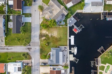 This is the one you've been waiting for -- 66 feet of waterfront on Gulf Harbors Golf Course in Florida - for sale on GolfHomes.com, golf home, golf lot