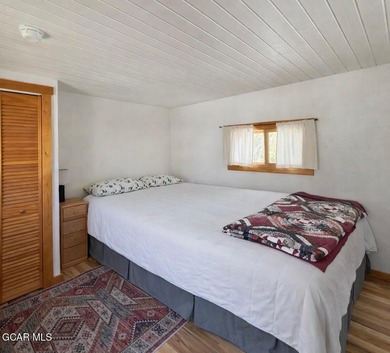 Step into a piece of history with this charming log cabin on Grand Lake Golf Course in Colorado - for sale on GolfHomes.com, golf home, golf lot