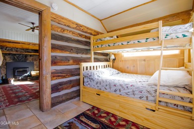 Step into a piece of history with this charming log cabin on Grand Lake Golf Course in Colorado - for sale on GolfHomes.com, golf home, golf lot