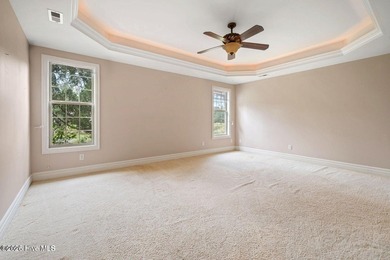 Welcome to your beautiful brick home overlooking a peaceful pond on Cape Fear National At Brunswick Forest in North Carolina - for sale on GolfHomes.com, golf home, golf lot