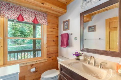 NO DAMAGE FROM HELENE-HIGH  DRY. This warm and inviting log home on Waynesville Country Club Inn in North Carolina - for sale on GolfHomes.com, golf home, golf lot