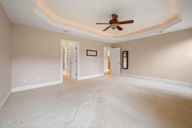 Welcome to your beautiful brick home overlooking a peaceful pond on Cape Fear National At Brunswick Forest in North Carolina - for sale on GolfHomes.com, golf home, golf lot