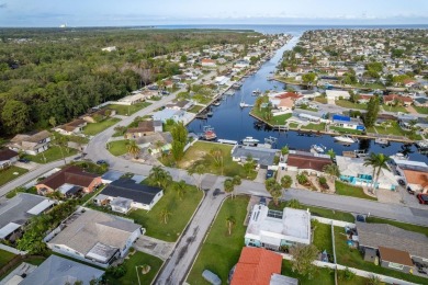 This is the one you've been waiting for -- 66 feet of waterfront on Gulf Harbors Golf Course in Florida - for sale on GolfHomes.com, golf home, golf lot
