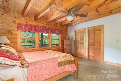 NO DAMAGE FROM HELENE-HIGH  DRY. This warm and inviting log home on Waynesville Country Club Inn in North Carolina - for sale on GolfHomes.com, golf home, golf lot