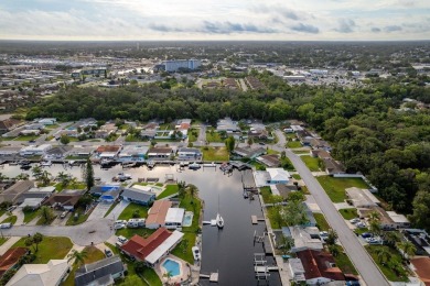 This is the one you've been waiting for -- 66 feet of waterfront on Gulf Harbors Golf Course in Florida - for sale on GolfHomes.com, golf home, golf lot