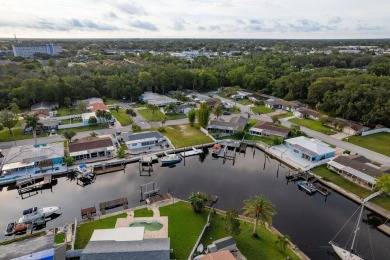 This is the one you've been waiting for -- 66 feet of waterfront on Gulf Harbors Golf Course in Florida - for sale on GolfHomes.com, golf home, golf lot