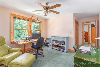 NO DAMAGE FROM HELENE-HIGH  DRY. This warm and inviting log home on Waynesville Country Club Inn in North Carolina - for sale on GolfHomes.com, golf home, golf lot