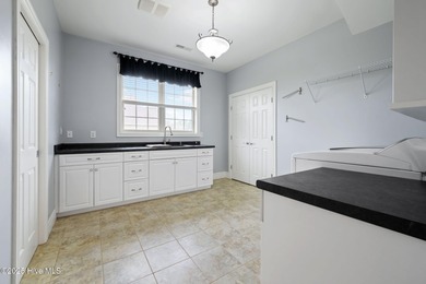 Welcome to your beautiful brick home overlooking a peaceful pond on Cape Fear National At Brunswick Forest in North Carolina - for sale on GolfHomes.com, golf home, golf lot