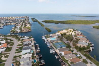 This is the one you've been waiting for -- 66 feet of waterfront on Gulf Harbors Golf Course in Florida - for sale on GolfHomes.com, golf home, golf lot